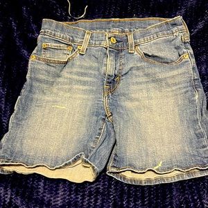 Levi shorts past mid thigh with minor white paint marks
